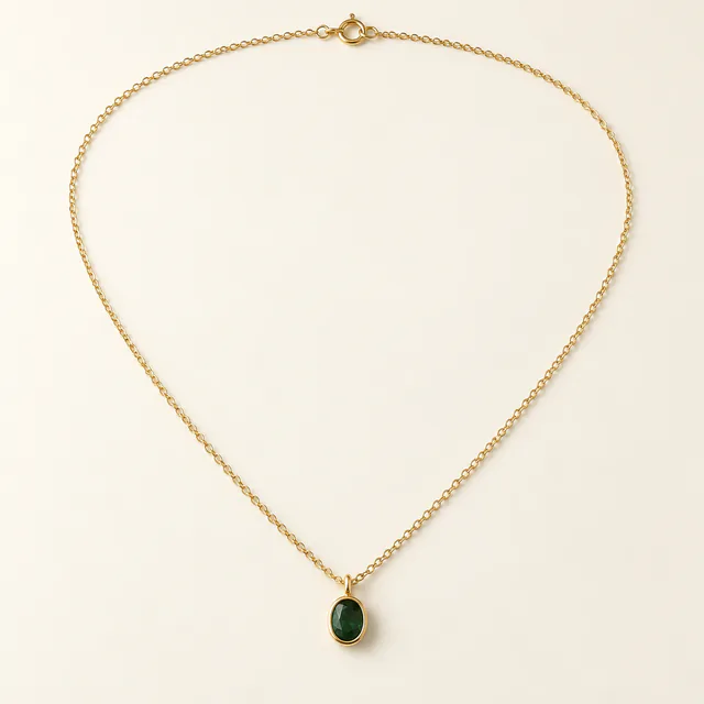 Emerald pendant on a fine gold necklace