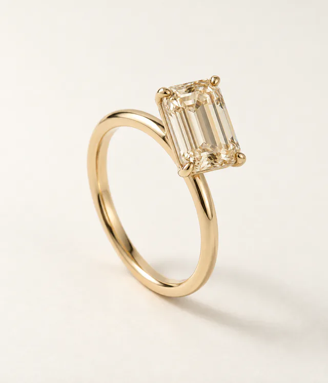 Emerald-cut champagne diamond ring in a warm gold setting